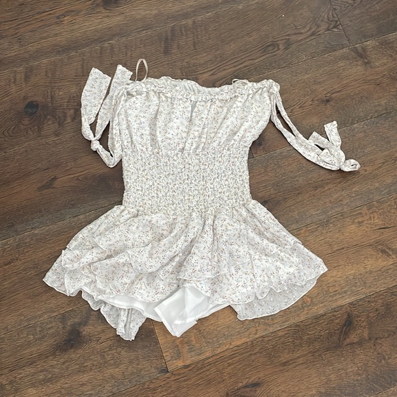 floral white romper. Never worn. Straps can be over shoulders or to the side. - Picture 2 of 2